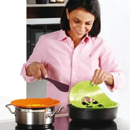Spill Proof Silicone Pot Cover Prevents Boil Overs Fits 6 to 9.5 in on pots preventing splatter with steam vent and center drain
