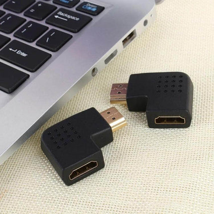 HDMI Adapter with 90-Degree Angle for Flexible Connections showing two black right-angle HDMI adapters beside a laptop port