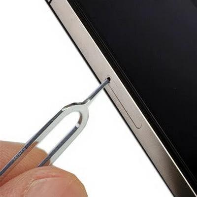 100 SIM Card Eject Pins for Smartphone SIM Management - single eject pin inserted into smartphone SIM tray for quick access and travel-ready portability