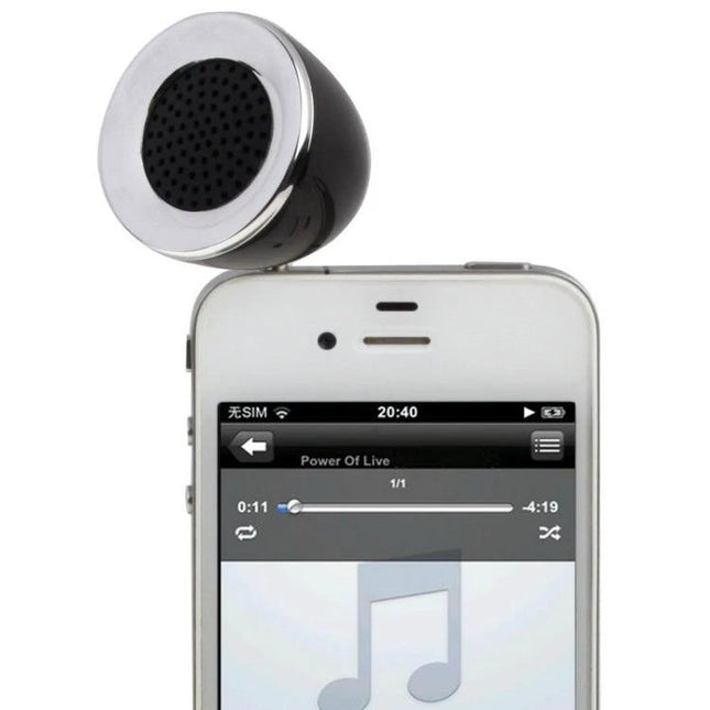 Compact Portable Speaker 3.5mm Jack For On The Go Listening shown plugged into smartphone for portable music on commutes