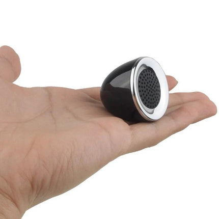 Compact Portable Speaker 3.5mm Jack For On The Go Listening shown small black 36mm speaker in palm for mobile use