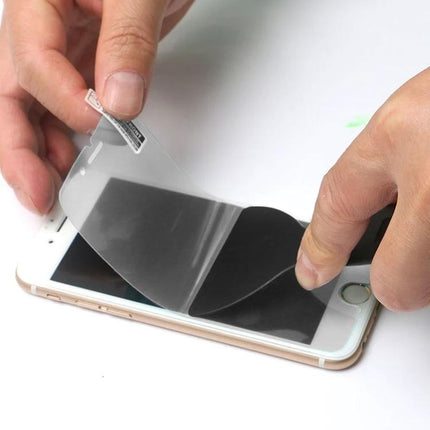 Plastic Scraper Tool for Phone and Tablet Screen Protectors being used to apply a bubble-free screen protector on a smartphone
