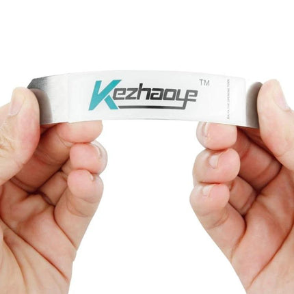 Thin Pry Blade Tool for Opening Smartphone and Tablet Casings — hands holding flexible metal pry blade for phone and tablet repairs