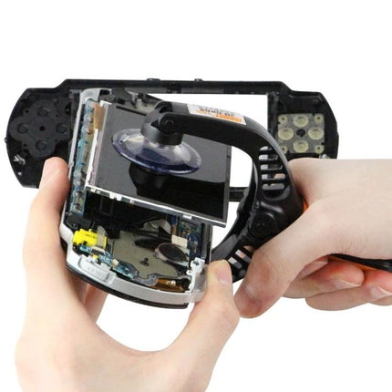 Jakemy Universal Mobile Screen Repair Tool for Smartphones being used to safely lift a cracked smartphone screen with a suction cup and pry tool