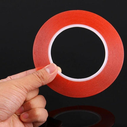 2mm Wide Double Sided Adhesive Tape for Mobile Phone Repair, 25m Length - red double-sided tape roll held by hand for screen repairs and DIY phone component bonding