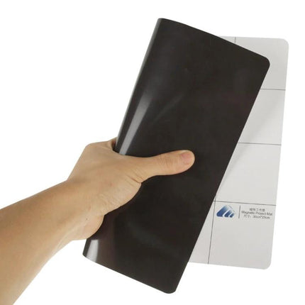 Magnetic Project Mat for Phone Repairs, 30cm x 25cm held rolled to show magnetic surface and grid organizer for screws and small parts