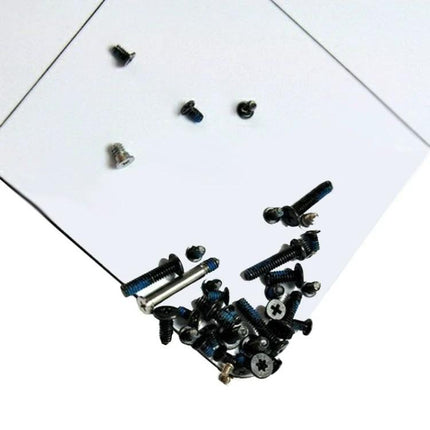 Magnetic Project Mat for Phone Repairs, 30cm x 25cm showing scattered screws held on magnetic surface with grid lines for organization
