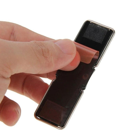Universal Foldable Phone Stand with Finger Grip for Easy Holding shown in hand peeling adhesive strip on compact 2-in-1 foldable mobile stand