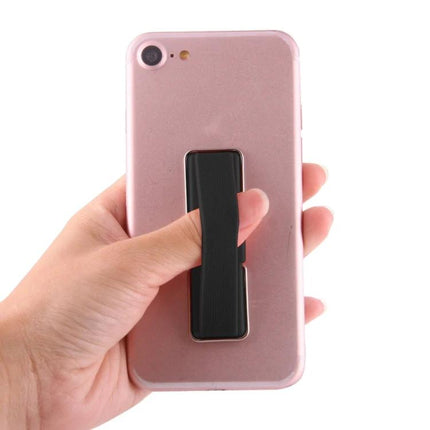 Universal Foldable Phone Stand with Finger Grip for Easy Holding shown on a pink phone being held securely