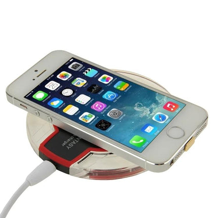 Convenient Charging Pad for Everyday Home Phone Use on bedside table charging an iPhone wirelessly, Qi-compatible, cable-free convenience