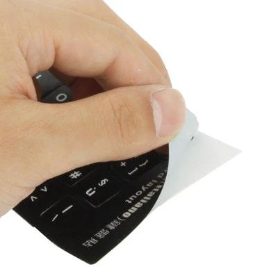 Italian Keyboard Stickers for Laptop and Desktop Computers - hand peeling black Italian keyboard sticker sheet for easy application