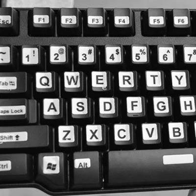 Russian Keyboard Stickers for Laptops and Desktops for Learning shown on black keyboard to help language learners type Russian characters