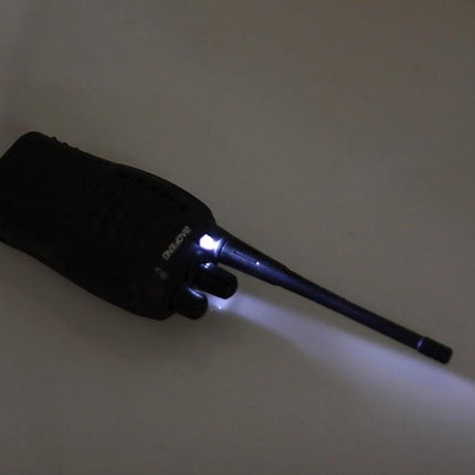 BAOFENG Portable Walkie Talkie for Everyday Communication showing handheld two-way radio with lit flashlight and extended antenna