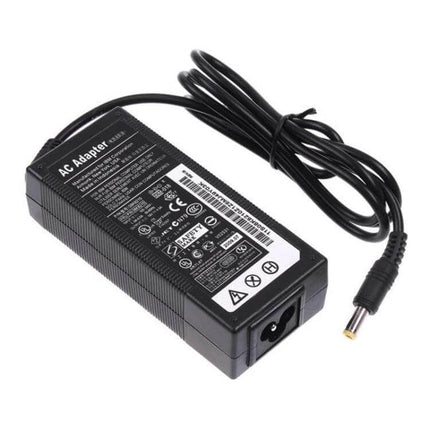 Universal AC Adapter for ThinkPad Notebooks with International Plugs powering black ThinkPad-compatible laptop with detachable international plug set