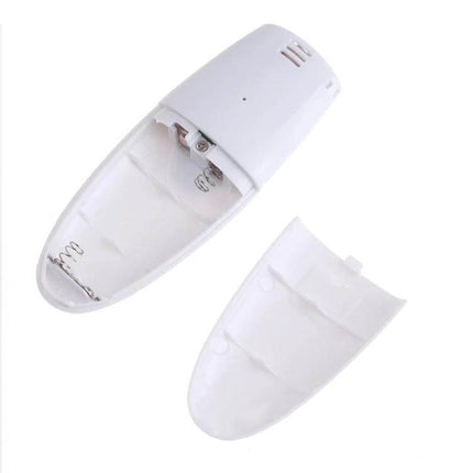 Compact Digital Breath Alcohol Tester with Audible Alert for Safety showing white device with open battery compartment and removable cover