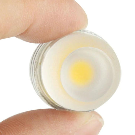 Warm White Light Bulb for Everyday Home Lighting Tasks - 3W G4 base LED held between fingers showing soft 3000-3500K glow