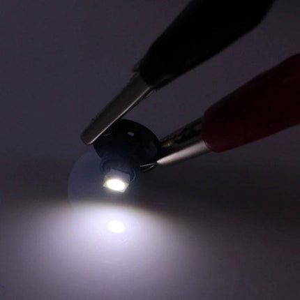 T3 White LED Instrument Dash Light Bulbs 2-Pack for Vehicles glowing white LED held by test clips showing bright dash illumination