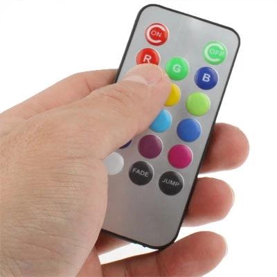 LED Light for Setting Cozy Home Moods with Remote Control - hand holding color remote for 13-color ambiance adjustment