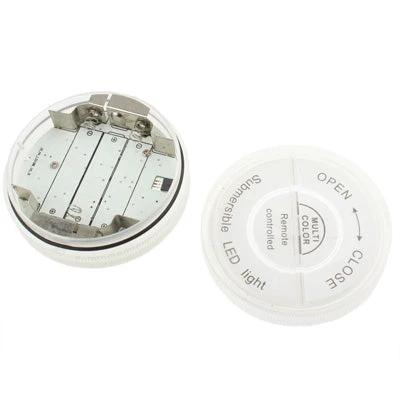 Versatile Light for Everyday Home Mood Settings - compact color-changing LED puck light with remote, battery compartment and removable lid