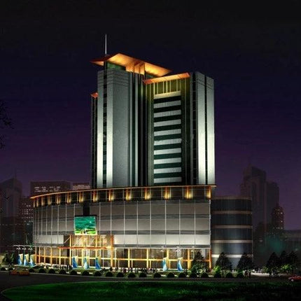Essential LED Lights for Daily Home and Studio Use illuminating modern mixed-use building exterior at night