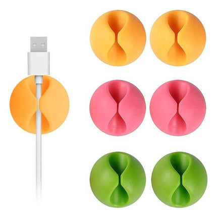 Keep Your Home Desk Cables Organized With These Clips - colorful round adhesive cable clips holding USB cable on white desk