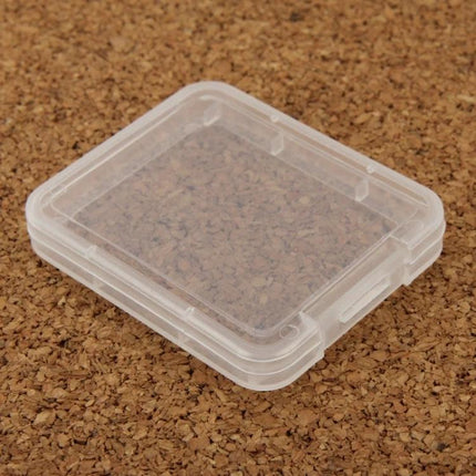100 Pack Transparent Plastic Storage Boxes for CF Cards - clear protective CF card case on cork background
