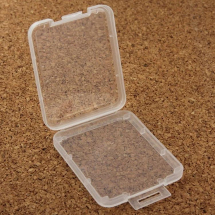 100 Pack Transparent Plastic Storage Boxes for CF Cards - clear individual CF card case open on cork surface, dust and scratch protection