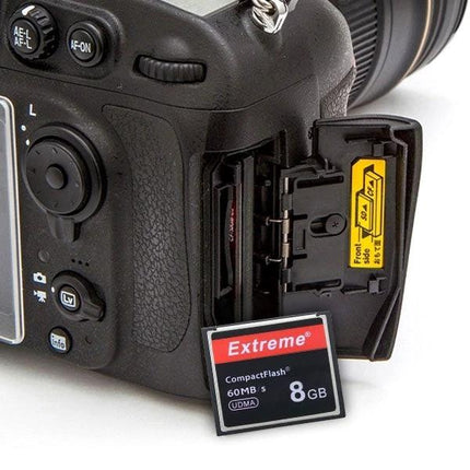 8GB Extreme Compact Flash Card for Digital Cameras inserted next to a DSLR showing 60MB/s read speed and rugged design