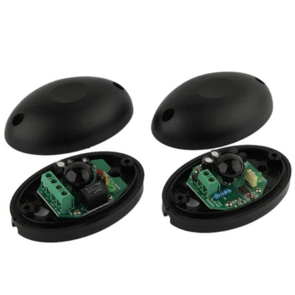 Single Beam Infrared Security Detector with 20 Meter Range black oval emitter and receiver pair showing internal circuit boards