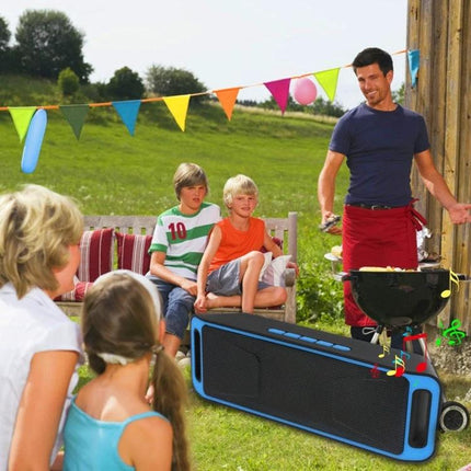 Compact Bluetooth Speaker For Everyday Listening And Calls placed near family barbecue outdoors for music, calls, TF card, FM radio use