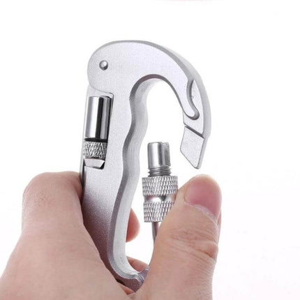 Heavy Duty D-Shape Carabiner With Knife For Camping - silver aluminum locking carabiner with folding knife and LED, shown held in hand