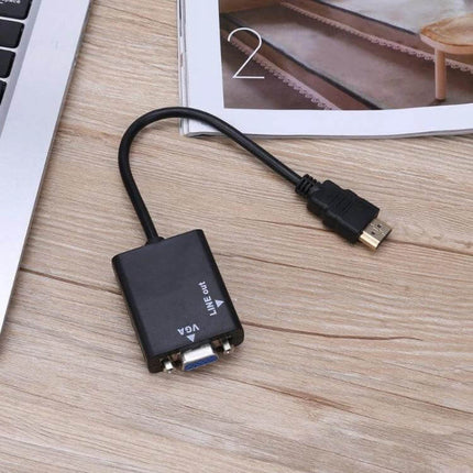 HDMI to VGA Video Conversion Cable with Audio Output, 26cm shown connecting laptop HDMI to VGA monitor with audio jack