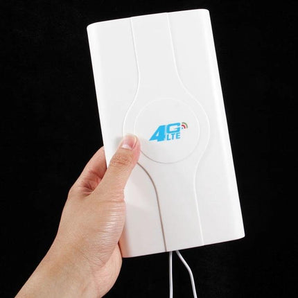 Indoor 4G LTE Antenna for Signal Improvement in Weak Areas - white indoor antenna held by hand to boost mobile signal