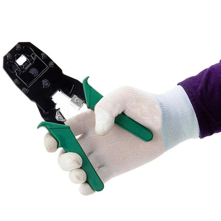 Versatile Crimping Tool for Network and Telephone Cables held by gloved hand, green-handled metal crimper for cutting, stripping and crimping cables