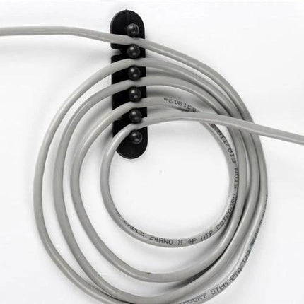 Adhesive Plastic Holder for Organizing Cable Plugs, Pair mounted on wall holding coiled cords neatly with stain-free removable adhesive