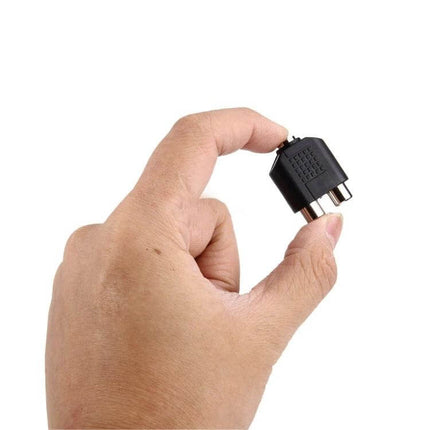 Audio Adapter for 3.5mm to Dual RCA Connections at Home - hand holding 3.5mm female to dual RCA female stereo adapter plug