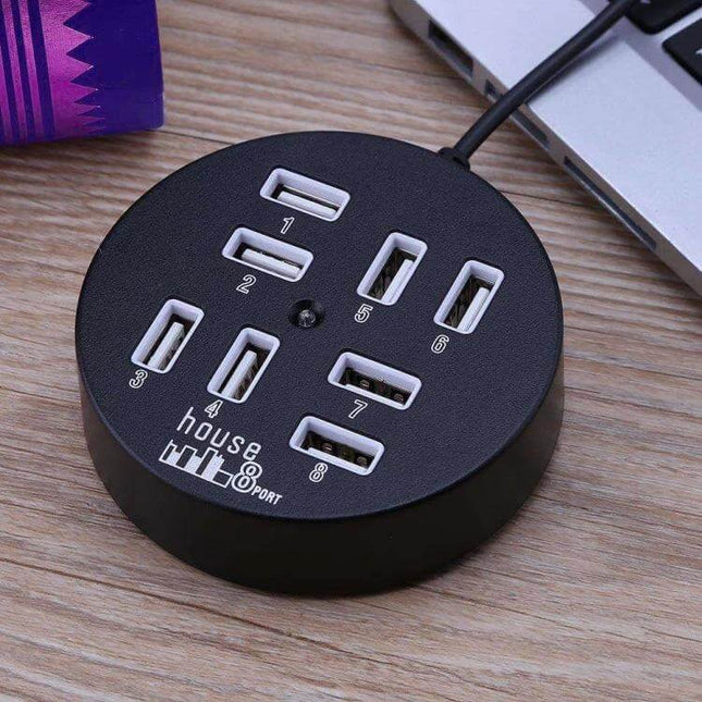 Portable 8-Port USB 2.0 Hub for Laptops and Devices - round black desktop hub with numbered USB ports connected to a laptop