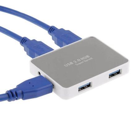 USB 3.0 Hub with 4 Ports and Transmission Cable for Device Connections - compact silver 4-port USB 3.0 hub with attached blue cable, plug-and-play