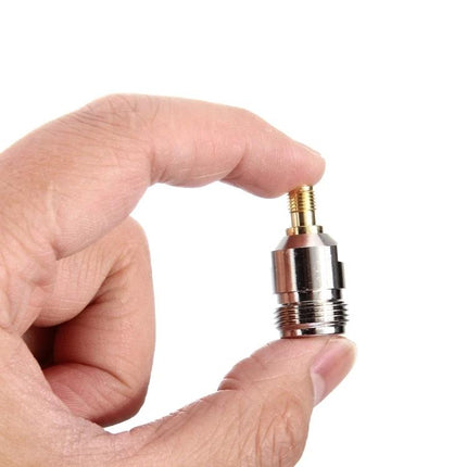 RP-SMA Female to N Female Connector Adapter for Antennas held between fingers, showing RP-SMA and N female ends