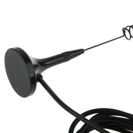 Nagoya Dual Band Magnetic Antenna for Walkie Talkies mounted on metal surface with cable coiled, black magnetic base and whip antenna