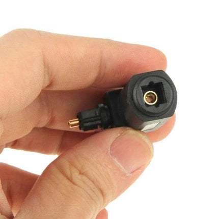 Right-Angle TOSLINK Digital Audio Adapter for Optical Cables held in hand showing 90-degree bend and 360° rotation for tight spaces