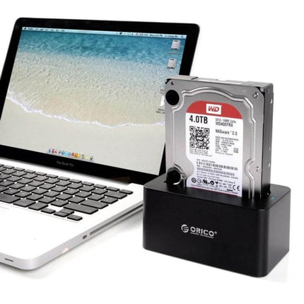 Orico Hard Drive Docking Station for 2.5 and 3.5 Inch Drives shown with 4TB HDD connected to laptop via USB 3.0