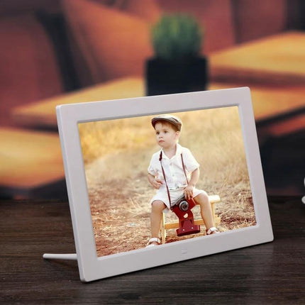 12.1-Inch Digital Photo Frame with Holder and Remote Control displaying a child photo on a desk with built-in stand