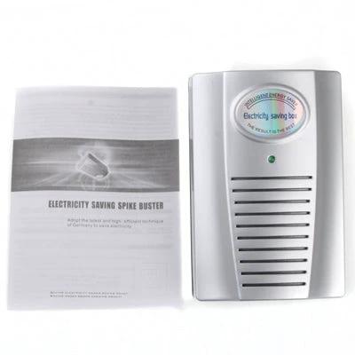 Intelligent Digital Energy Saving Device for Home Use plugged into wall outlet next to manual, white surge-saving unit for household energy management
