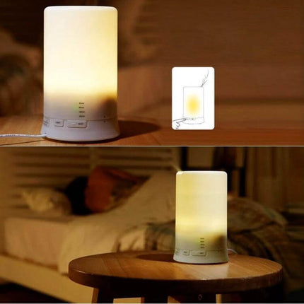 Mini USB Aroma Diffuser With Warm White LED Lights on nightstand emitting soft warm light and mist, compact desk humidifier and fragrance diffuser