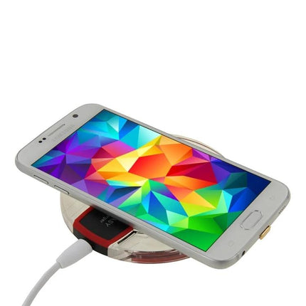 A Practical Charger for Daily Phone Use at Home wireless charging pad on a desk charging a smartphone