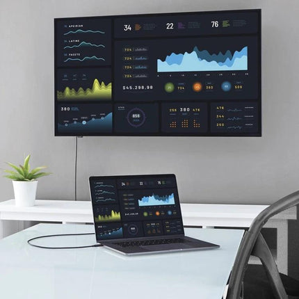 Cable for Connecting Phones and Tablets in Daily Use plugged into laptop charging and data transfer setup with dashboard screens