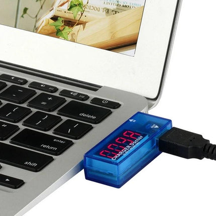 Portable USB Current and Voltage Tester for Mobile Chargers plugged into laptop USB port showing digital readout