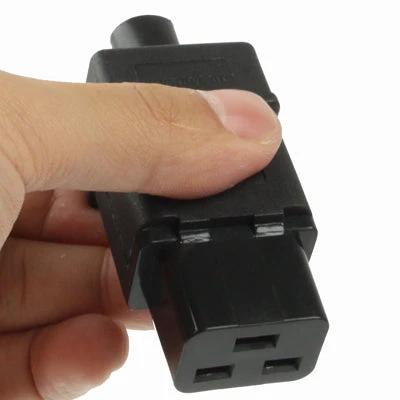 Universal Travel Power Adapter with 3-Prong Female Socket for Global Use compact black adapter held in hand for international charging