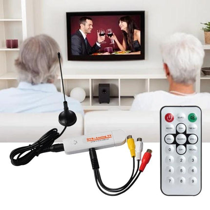 Compact USB Analog TV Stick for Viewing TV on Your Computer plugged into laptop USB with antenna and remote, portable solution for watching live TV